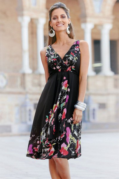 Black fitted wrap midi wrap dress with floral print and v-neckline