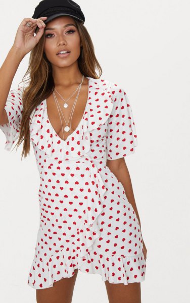 White and red heart print mini wrap dress with V-neckline and ruffles