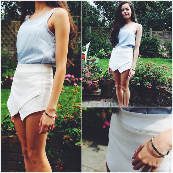Gray scoop neck tank top and white mini fold over skirt