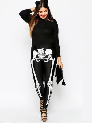 Black chunky knit sweater with a crew neck, skeleton leggings and open heels