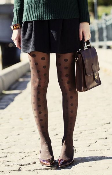 gray cable knit sweater with black mini skirt and polka dot tights