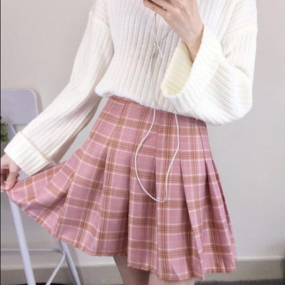 White rib knit sweater with pink pleated check mini skirt