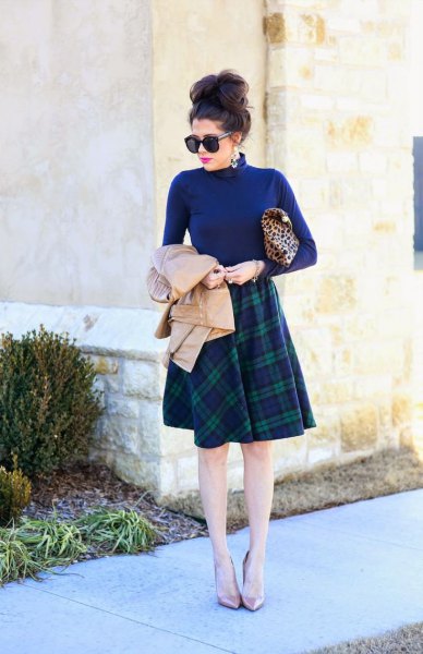 Blue sweater with a stand-up collar and a knee-length checked skirt