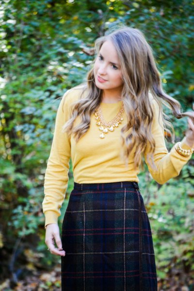 lemon yellow sweater with dark wool midi skirt