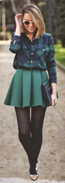 Navy blue plaid shirt with gray high rise pleated skater
skirt