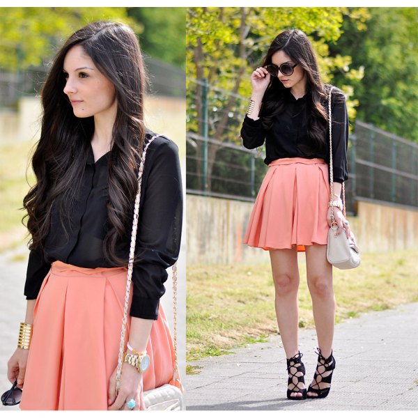 Black button down shirt and light orange mini skater skirt