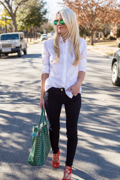 White silk button down shirt and black slim fit jeans