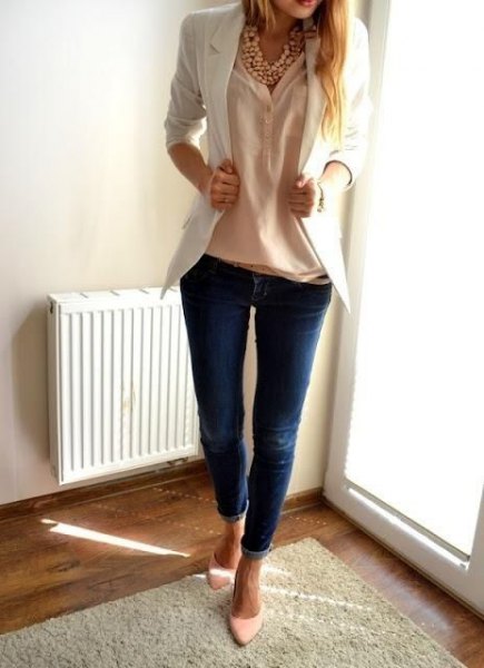 Cream blouse with ivory blazer and dark blue skinny jeans