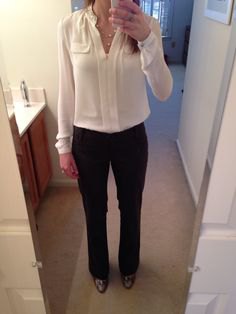 Cream blouse with black chinos and leather ankle boots