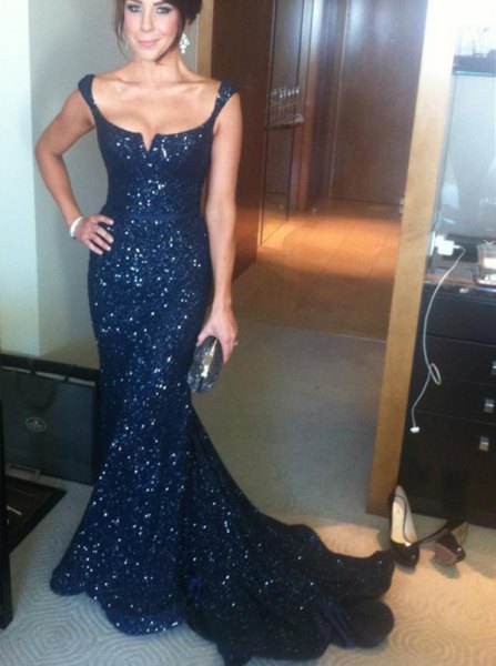 Navy blue evening dress with a plunging scoop neckline and sequins in a mermaid style