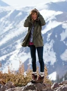gray parka jacket with navy and white checked hiking shirt and boots