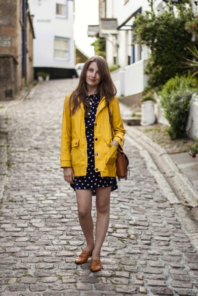 yellow rain jacket with black and white polka dot mini sheath
dress