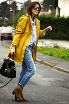 yellow oversized raincoat with boyfriend shirt and ripped jeans