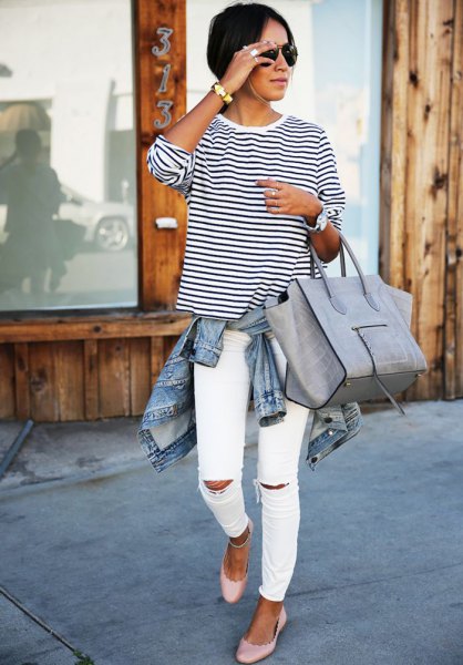 Black and white striped crew neck long sleeve t-shirt paired with ripped slim fit jeans