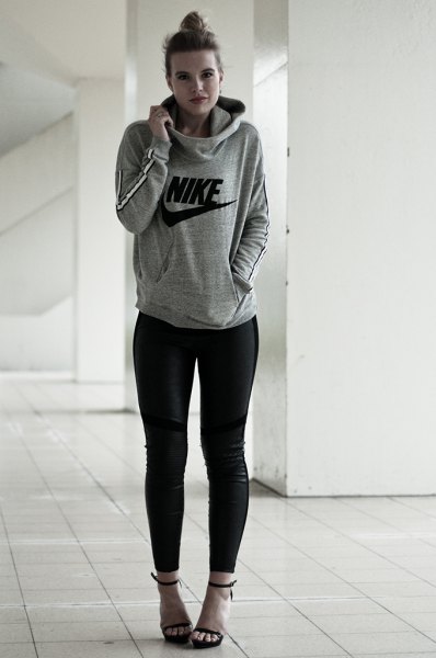 Gray hoodie with black skinny jeans and open heels