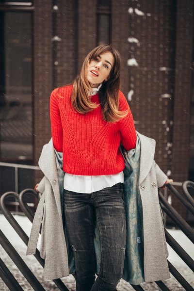 red ribbed sweater with white button down shirt and gray wool coat