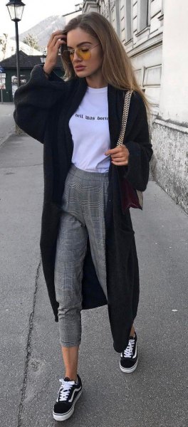 Black maxi cardigan with white graphic t-shirt and gray sweatpants