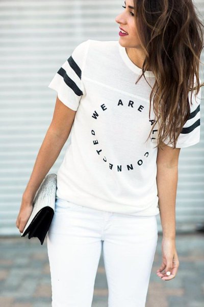 Cool white print T-shirt with matching skinny jeans and sequin clutch