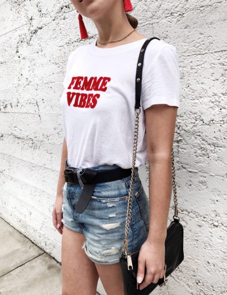 White and red graphic t-shirt with blue high-rise ripped denim shorts