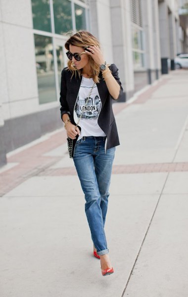 Black leather jacket with white printed t-shirt and blue cuffed jeans