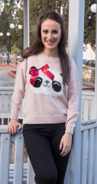 Light gray panda print sweater and black slim fit jeans