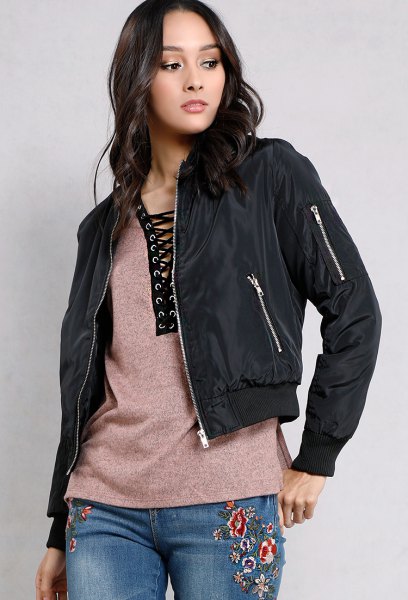black fitted jacket with gray lace-up t-shirt and embroidered
jeans