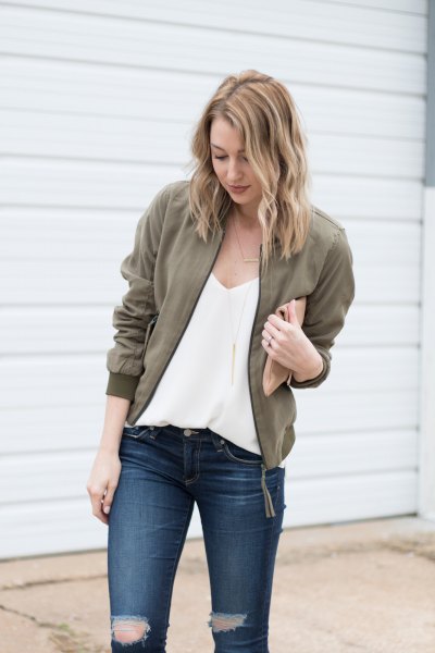Deep V-neck chiffon blouse, olive green jacket and ripped jeans