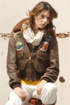 brown embroidered leather jacket with white linen pants