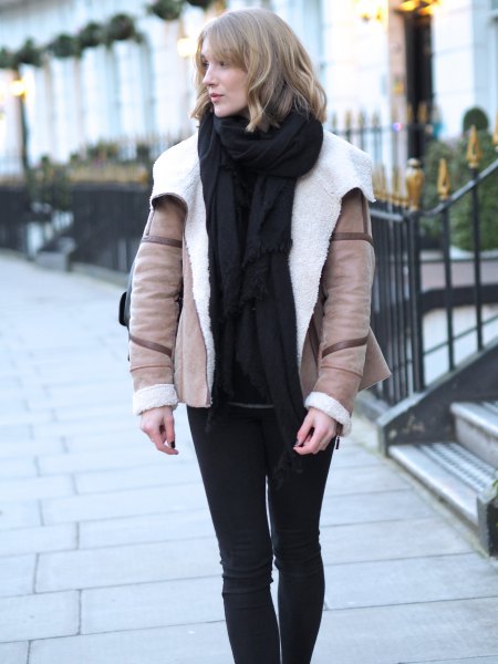 blush pink flight jacket with black sweater and knitted scarf