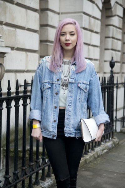 Light blue boyfriend denim jacket worn with a white cropped t-shirt and black jeans