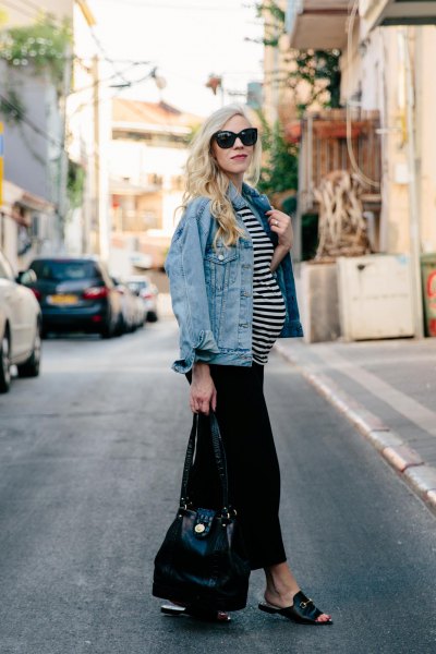 blue denim jacket with black and white striped top and black wide-leg pants