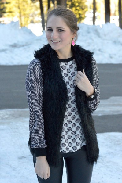 Black waistcoat with long-sleeved tribal top and dark gray jeans