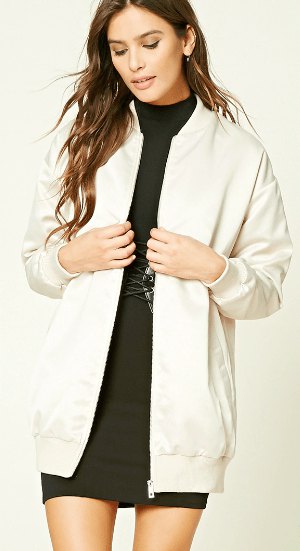 Long white bomber jacket with a black mini sheath dress with a stand-up collar