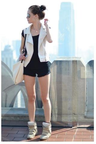 White sleeveless blazer vest with black mini shorts and blush sneakers