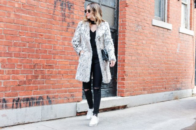 White long faux fur coat with ripped jeans and sneakers