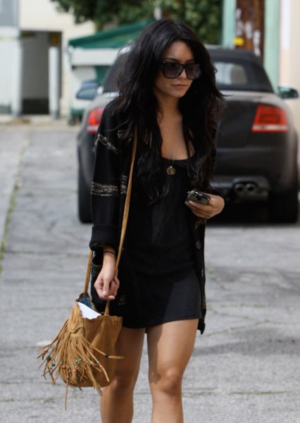 Black bomber jacket with a scoop neck tank top and mini shorts