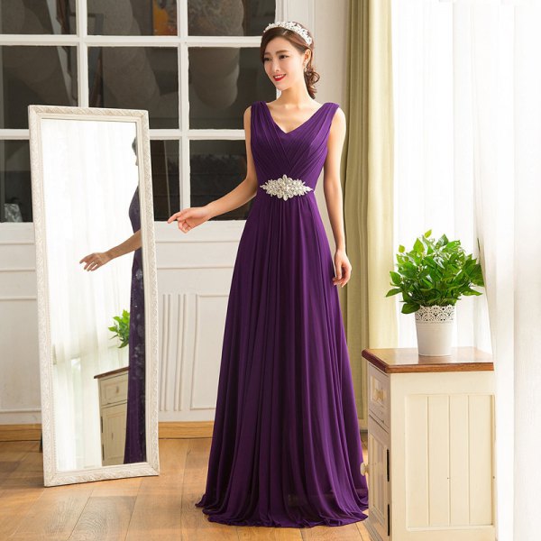 Deep violet floor-length long dress with a V-neckline and belted
sleeves