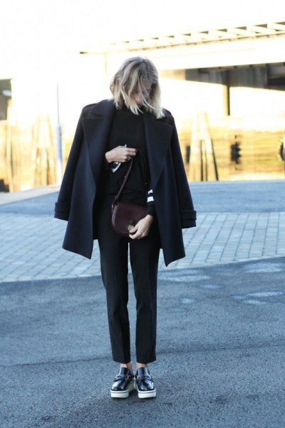Black wool coat with a stand-up collar sweater and leather low shoes