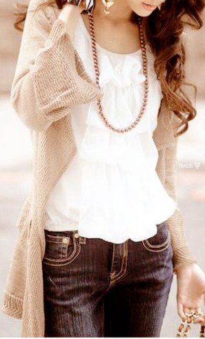 Long sweater jacket with a white ruffled blouse