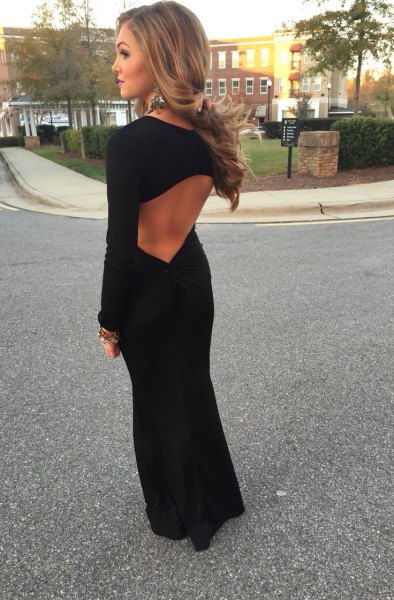 Black long-sleeved maxi dress with an open back and ballerina flats