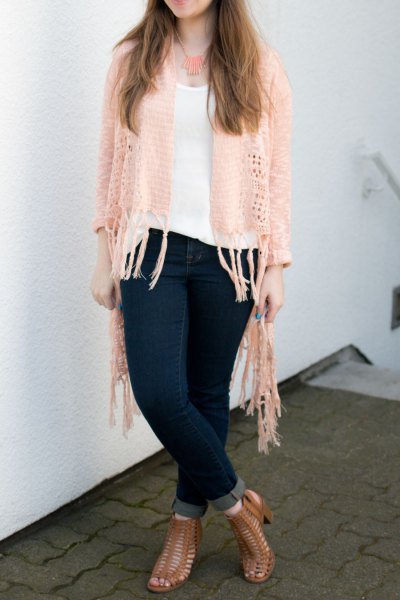 Ivory fringed crochet cardigan, white scoop neck tank top and dark blue skinny jeans