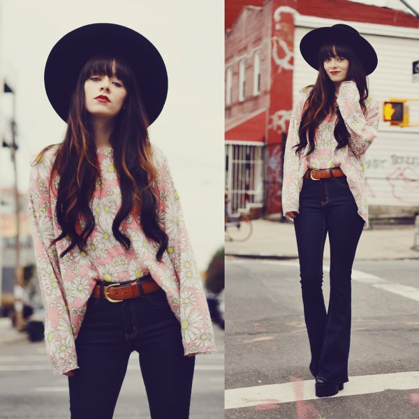 black fedora with light pink blouse and high-waisted trousers