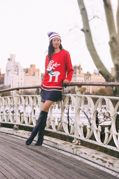 Red Christmas jumper with a black mini skirt