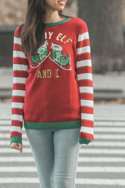 A red and white striped knit sweater with a round neckline and light gray skinny jeans go well with this