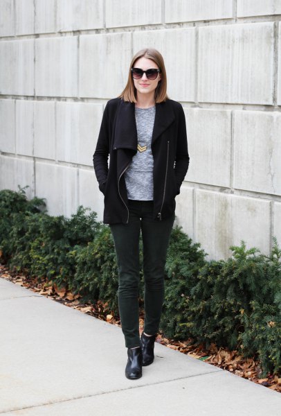 Black fleece jacket with a gray crew-neck t-shirt and dark gray corduroy jeans