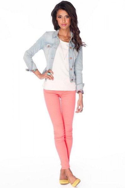Blue fitted denim jacket with pink jeans