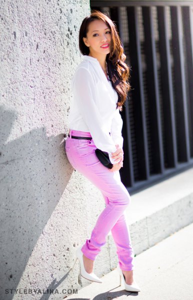 white chiffon blouse with colored slim fit jeans with belt