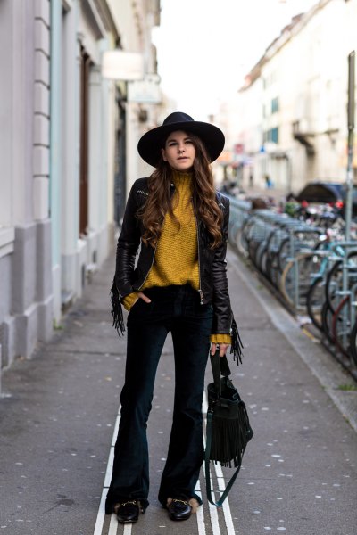 lime green turtleneck with black leather jacket and flared velvet jeans