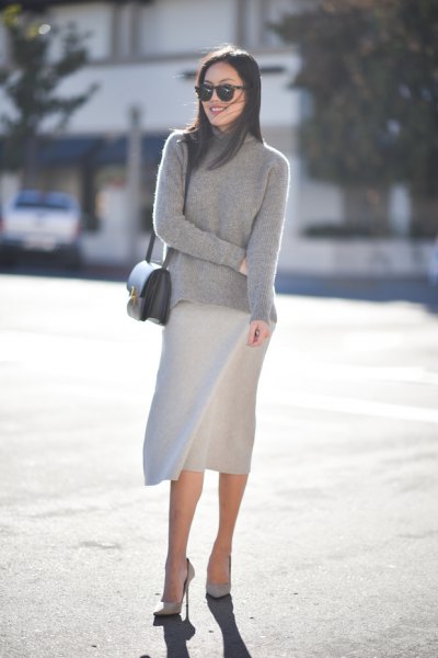 Gray stand-up collar sweater with a knee-length skirt