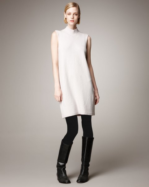 White sleeveless cashmere turtleneck sweater, leggings and boots